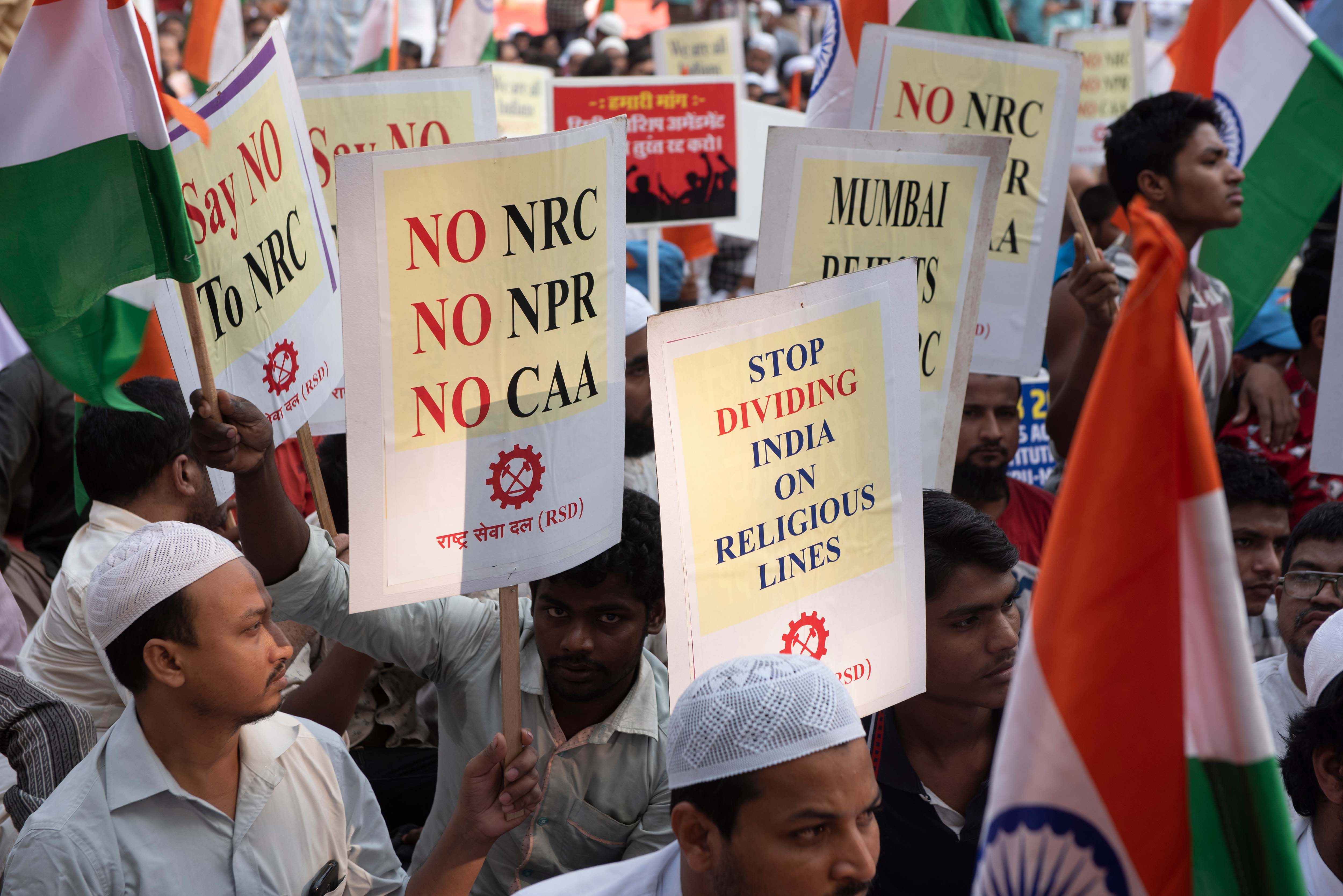 Mumbai / India 19 December 2019 Indian people with poster flag protests against anti muslim controversial Citizenship Amendment Bill ( CAB CAA )  at August Kranti Maidan in Mumbai Maharashtra India