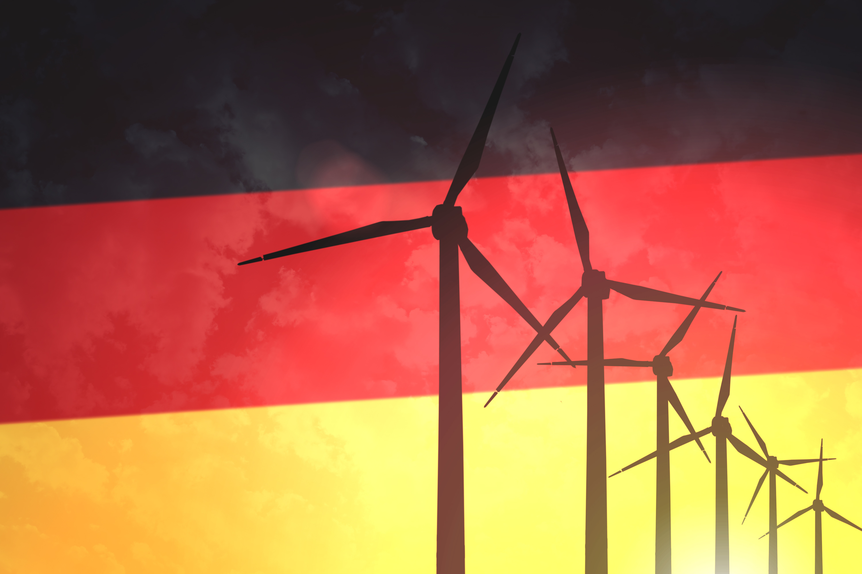Éoliennes sur fond de drapeau de l'Allemagne